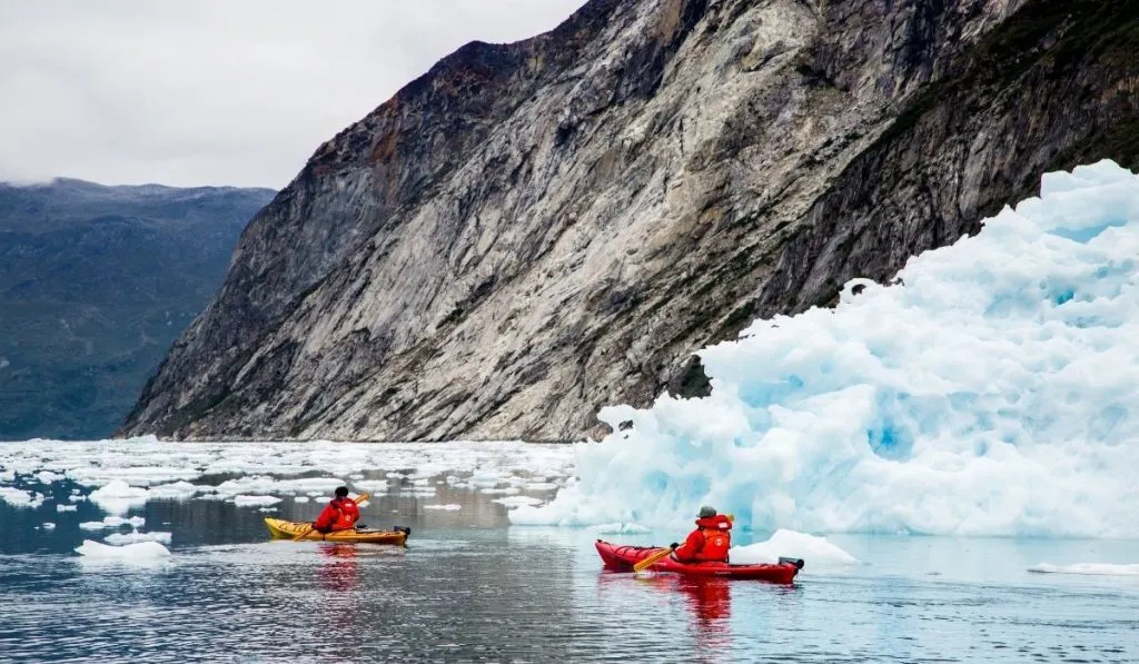 two kayakers exploring during the winter time - ss220324