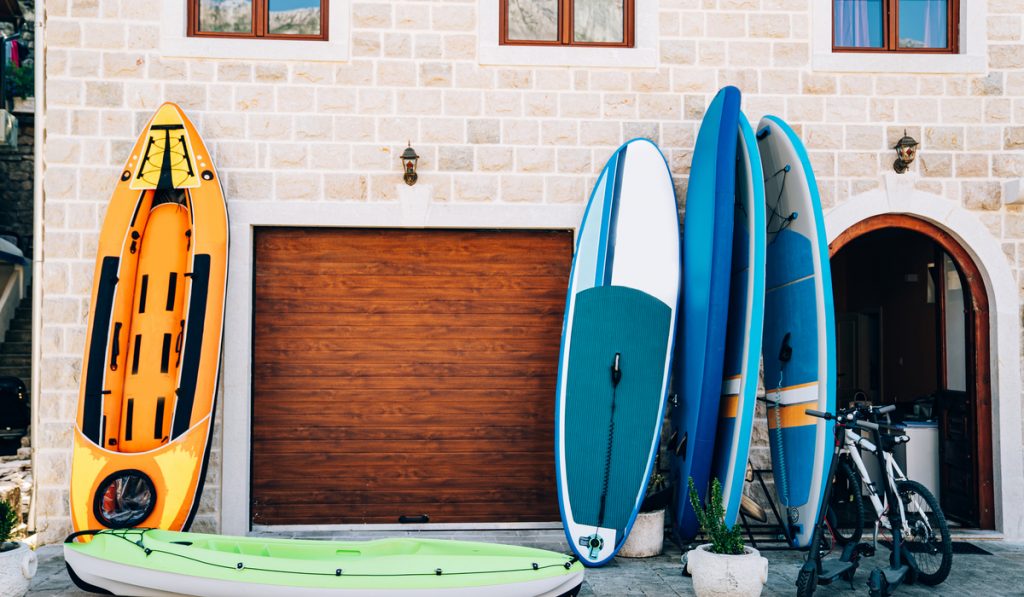 Different style paddle boards rental store 