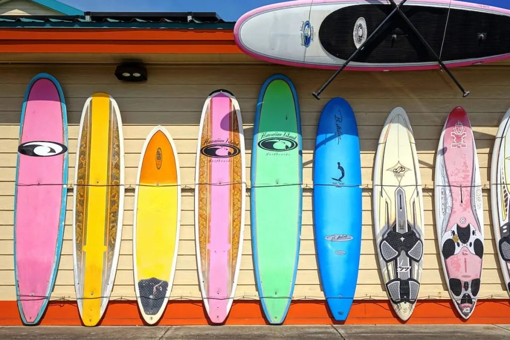  Colorful surfboards are lined up in the streets