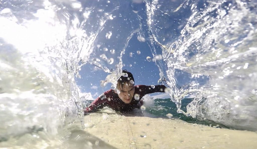man surfing close up photo 