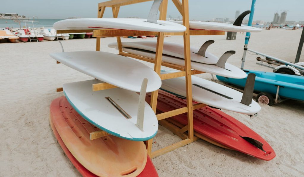 surfboards-stacked-on-the-rack-on-a-beach