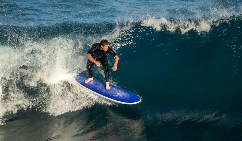 surfer catching a wave 