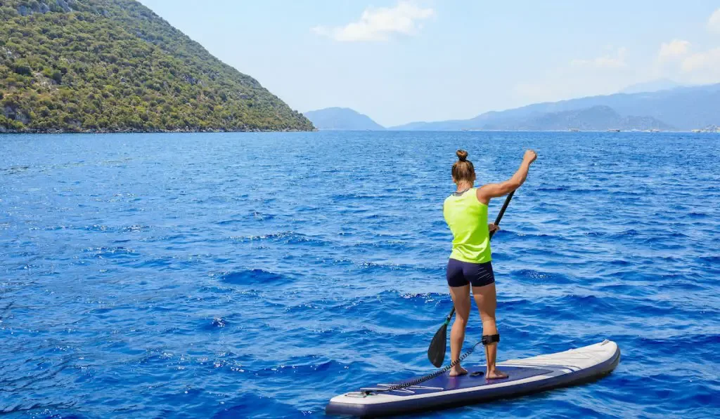 woman paddleboarding on paddleboard in the Mediterranean sea - ss220924