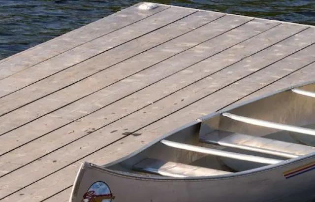 Aluminum Canoe resting on a dock of Canoe Lake - ss220917