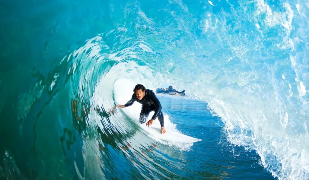 surfer on blue ocean waves