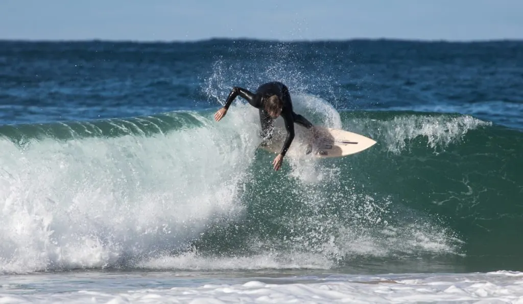 surfer surfing over big waves