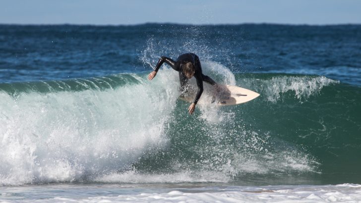 surfer surfing over big waves