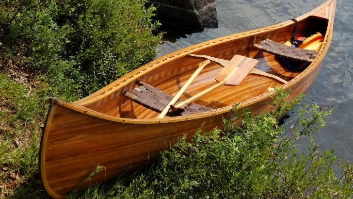 canoe resting on the lakeshore
