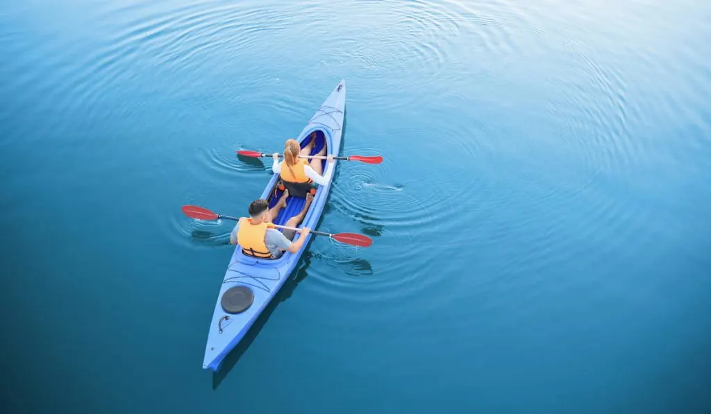 People kayaking in river 