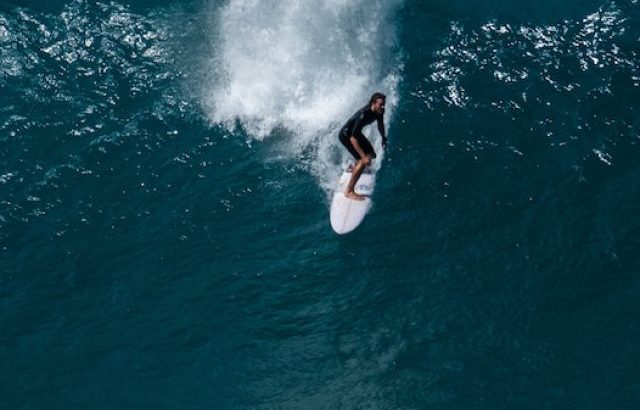 Surfer rides gigantic wave of Pipeline surf spot located on North Shore - ss221213