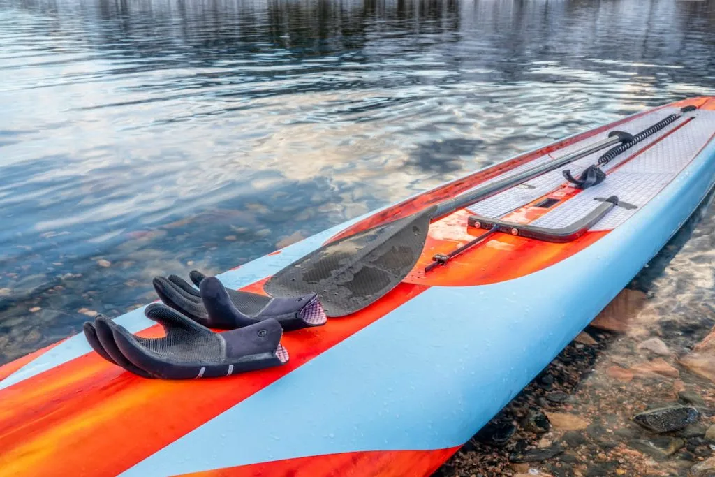 paddleboard with neoprone pair of gloves 
