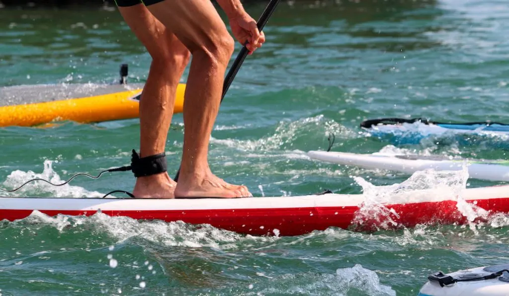 Athlete paddleboarding