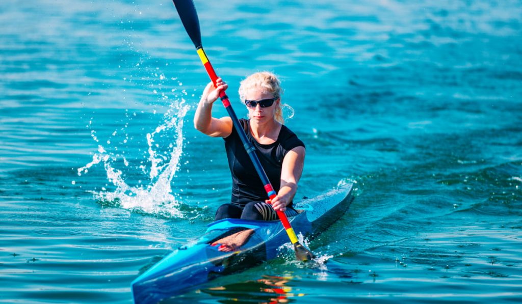 female athlete in kayak
