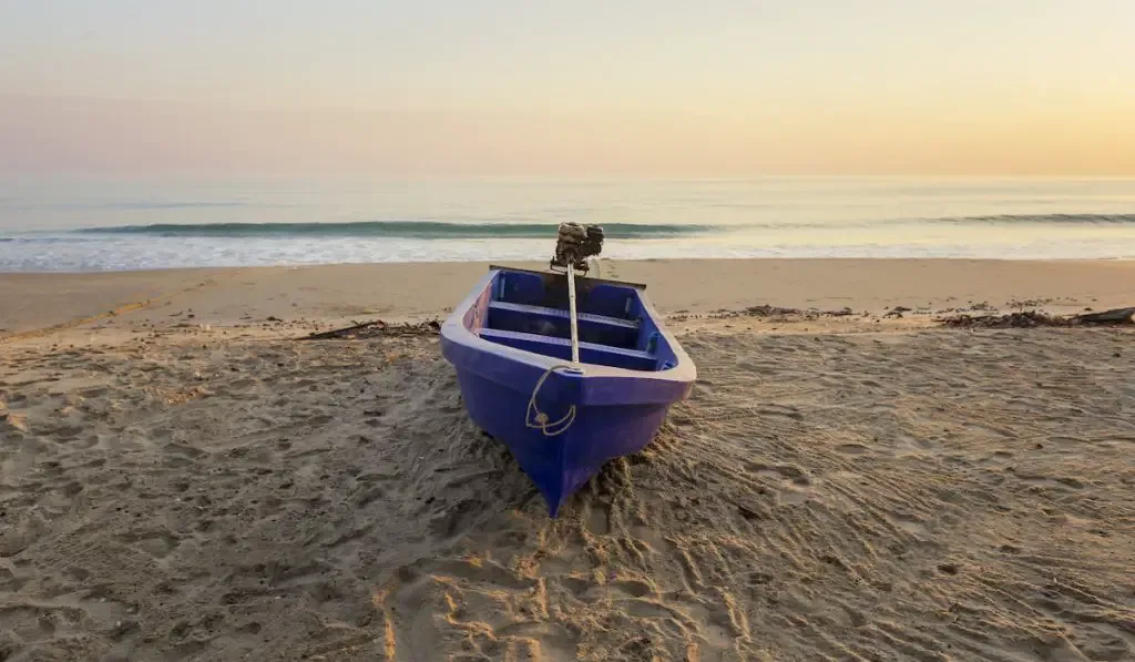 fiberglass boat on the beach 