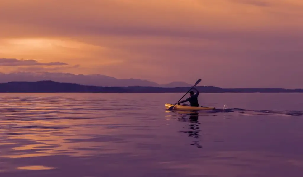kayak out to sea at sunset