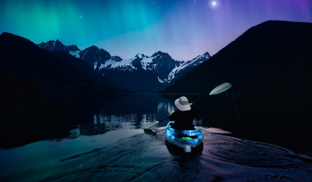 kayaking in a peaceful lake at night