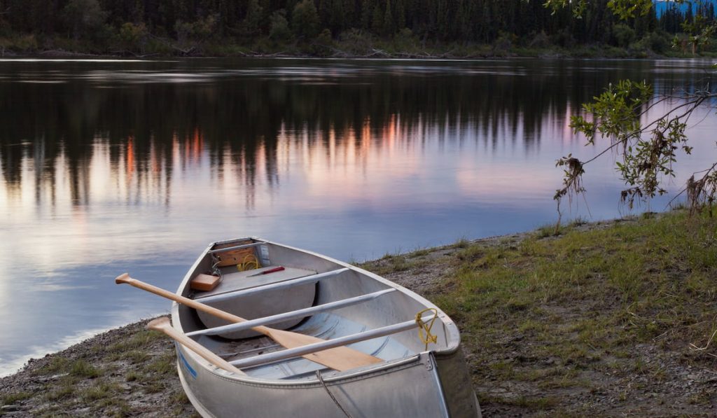 canoe beside a beautiful lake